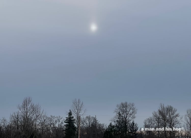 sun behind the clouds